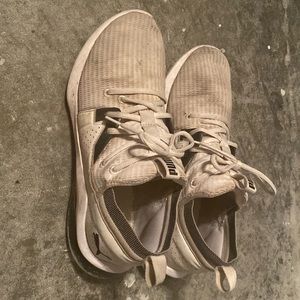 Worn white Pumas